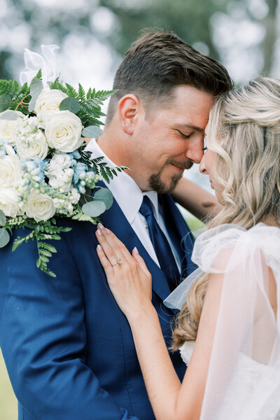 bride and groom touching foreheads