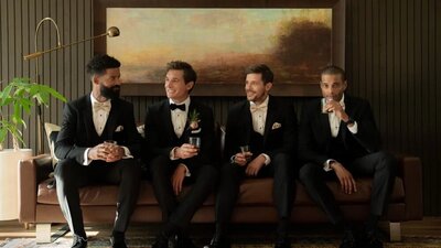 Groom with groomsmen in a black tux