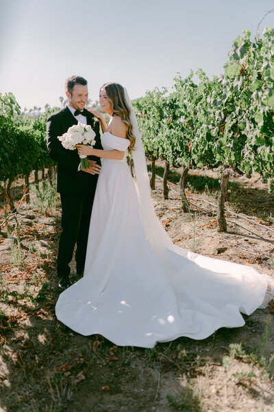 In the golden hills of Southern California, Adam and Bianca’s destination wedding unfolded with cinematic elegance at the renowned Falkner Winery—an estate where vines meet timeless vows. Captured through the refined lens of Michael Asmussen, an internationally recognized destination wedding photographer known for his editorial style and luxury storytelling, this celebration blended San Diego’s wine country charm with effortless sophistication. From sunlit portraits to curated design moments, every frame tells a story of intention, artistry, and romance. Michael’s work spans the most coveted destinations—Orange County, Palm Desert, Los Angeles, Tokyo, Las Vegas, Seoul, and beyond—crafted for modern couples who desire more than memories: they seek legacy.