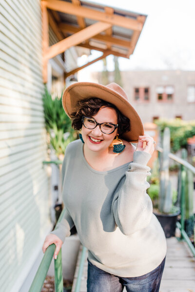 Copywriter Sara Gillis outside at a greenhouse