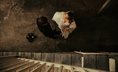 Bride and guests on dance floor at Paris destination wedding, moody cinematic Super 8