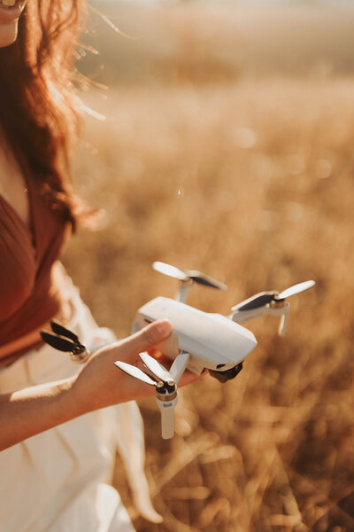 girl holding drone