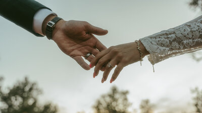 Bride walking barefoot through Sedona desert landscape during intimate wedding day