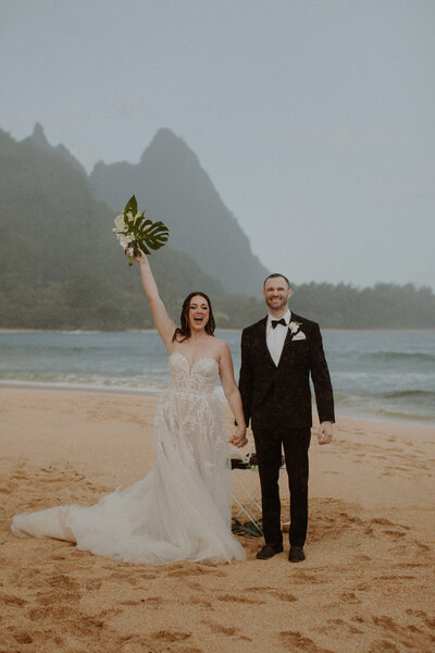 Bride celebrates elopement on beach in Kauai