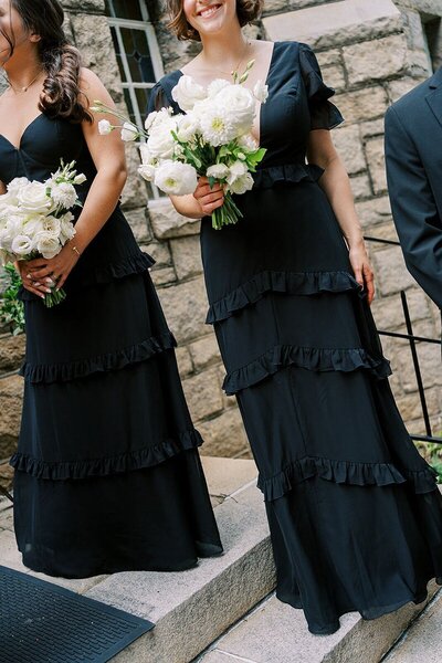Bridal party posing on the steps of an iconic North Carolina venue.