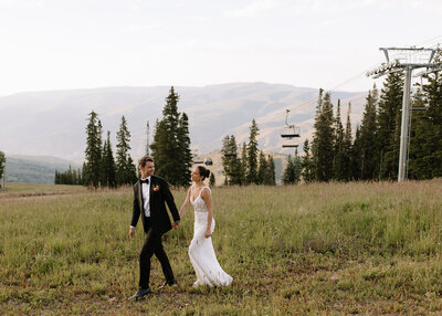 Bride and groom cheering at the alter in Colorado wedding