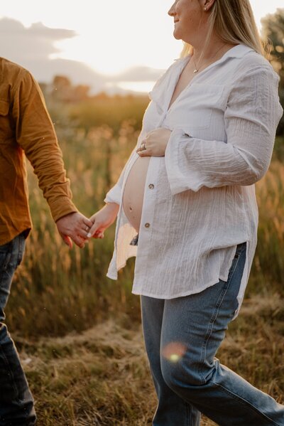 Baby looks at parents in photo taken by Loveland Newborn Photographer