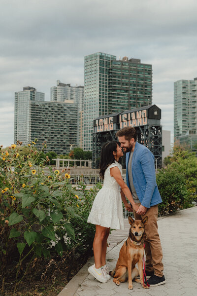 photography of a couple with their dog in long island city engagement photography by ever after by evelyn