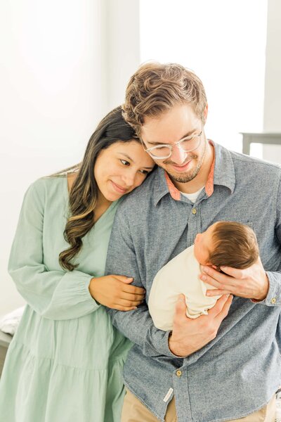 parents loving gaze into newborns eyes windsor, co