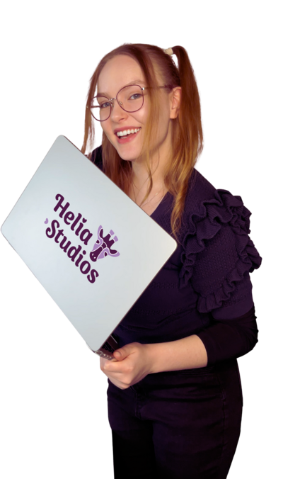 Designer Saara with laptop featuring Helia Studios logo