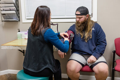 Ellie taking vital signs on a patient