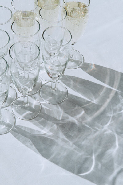 Close-up shot of glasses of champagne at en editorial luxury wedding in Kent