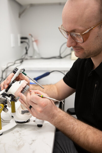 Prosthodontist making dentures