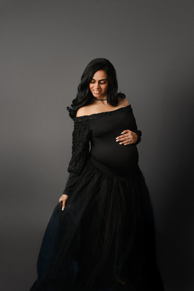 black maternity gown bold look in studio