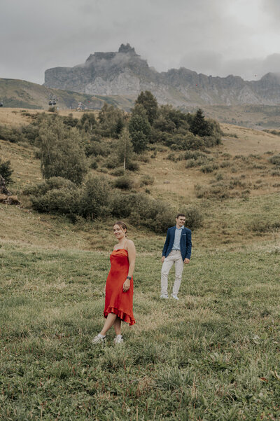 couple kissing and eloping on a mountain in the french alps