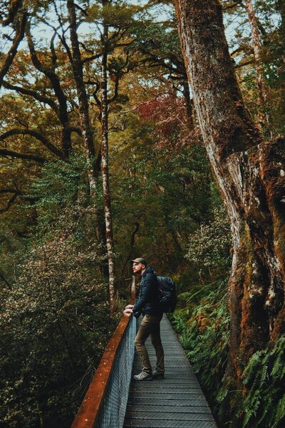 Wedding Photographer Connor Esau standing in a forest