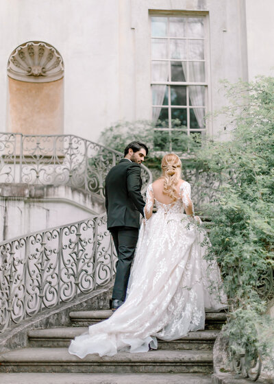 Bride and groom walk up memorial steps at their DC wedding