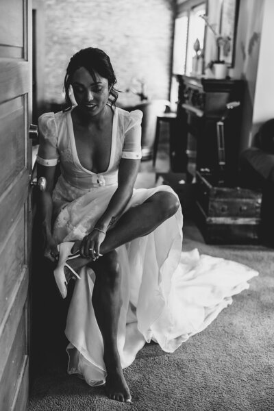 bride putting on shoes
