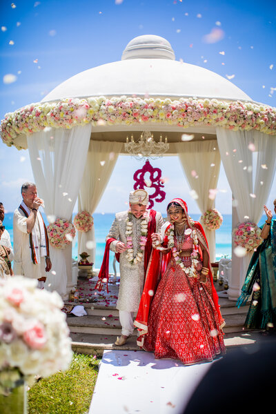 Immerse yourself in the vibrant and colorful celebration of Renesha and Chad's Indian wedding at the JW Marriott Hotel in Cancun. This exquisite photo gallery captures the rich traditions and joyous festivities, from the intricately decorated mandap to the lively sangeet night against the backdrop of Cancun's breathtaking beach views. Experience the blend of traditional Indian culture with the tropical luxury of Cancun, perfect for couples seeking an extraordinary destination wedding.