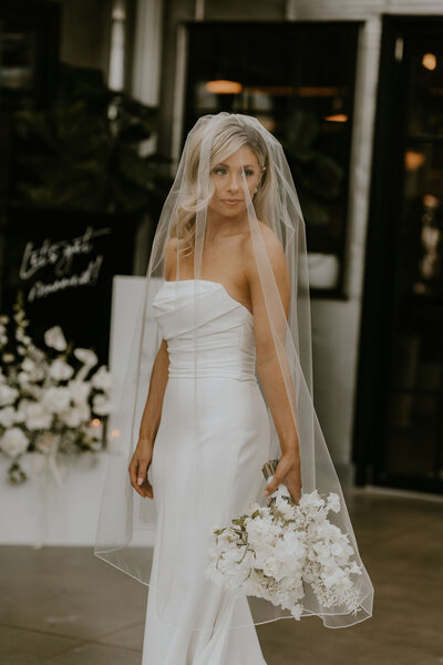 bride at wedding with wisconsin and minneapolis wedding videographer