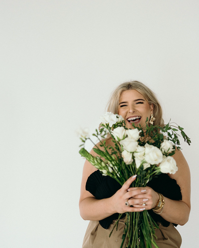 Online business owner branding photos holding florals | Megan Smith Photography