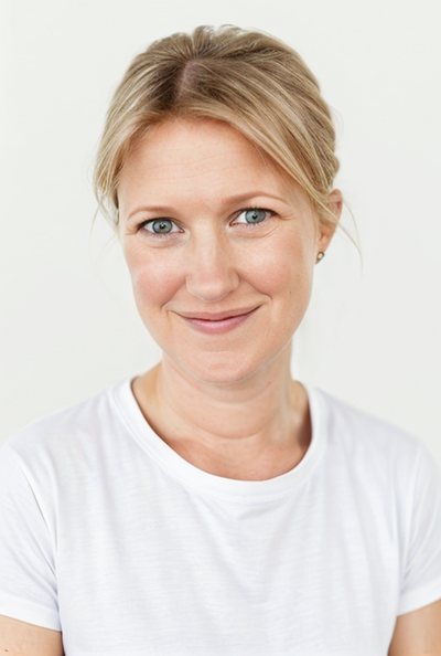 Becca Lincoln Maniar, Supported Awakening founder, Smiling against a white background