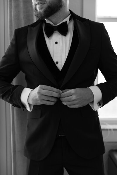 groom getting ready in his tom ford tuxedo for his wedding in Paros greece