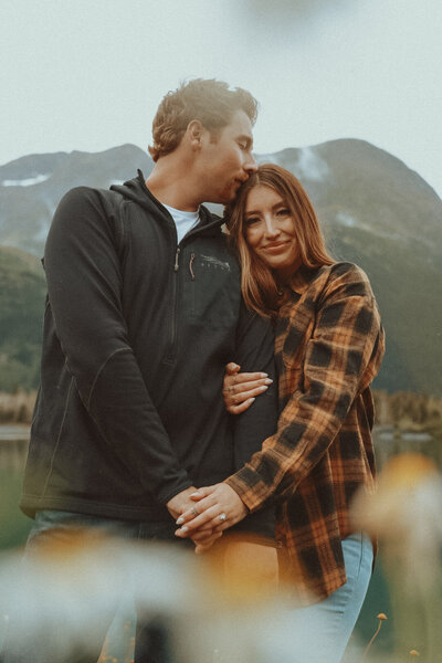 An adventurous couple during a cozy outdoor session in Washington, surrounded by PNW scenery.