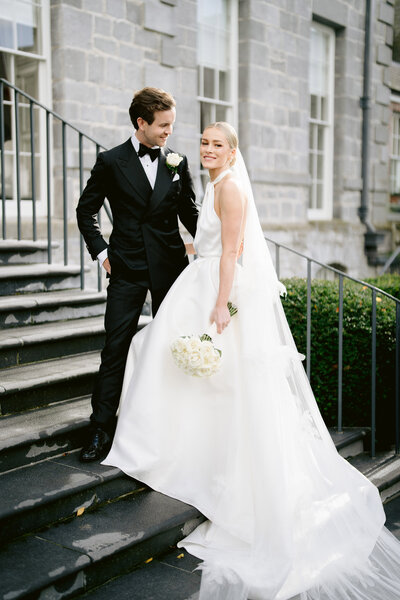 bride and groom wearing a tuxedo photo taken at a destination wedding in italy