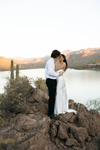 Bride and Groom standing in front of canyon lake in Phoenix Arizona 