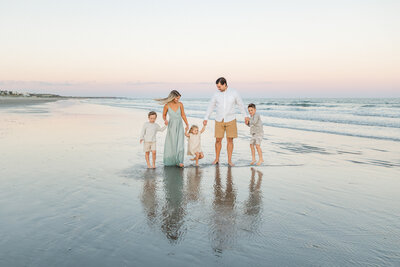 Family plays together at Isle of Palms in South Carolina by Karen Schanely
