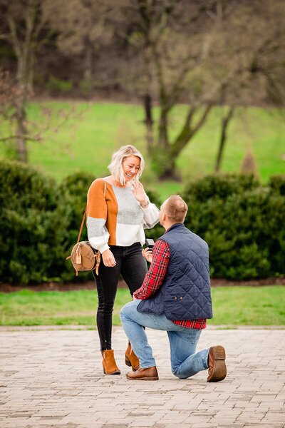 Surprise proposal outside of Ravenswood Mansion, cute fall attire
