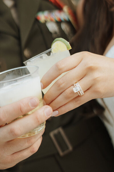 Wedding couple close up of hands and drinks