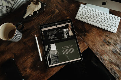 Ipad showing a photography website design on our Design Studios desk