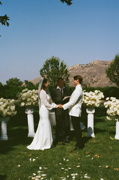 Payton & Evan saying their vows to each other at the ceremony. 