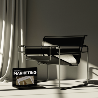 a macbook next to a modern black chair with a mockup of influencer marketing on the screen