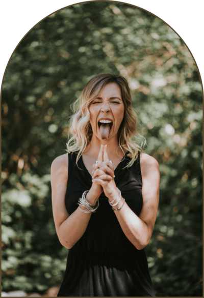 Shae Savage practicing yoga breathwork with her tongue out