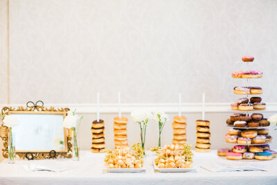 wedding dessert table of stacked donuts