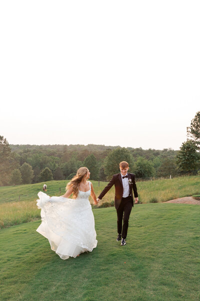 Couple in front of a classic car at their wedding reception at The Barn at Shady Lane