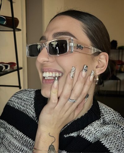 Woman wearing Jelly branded sunglasses