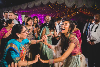 photo of bride dancing with her grandma at an asian cheshire wedding