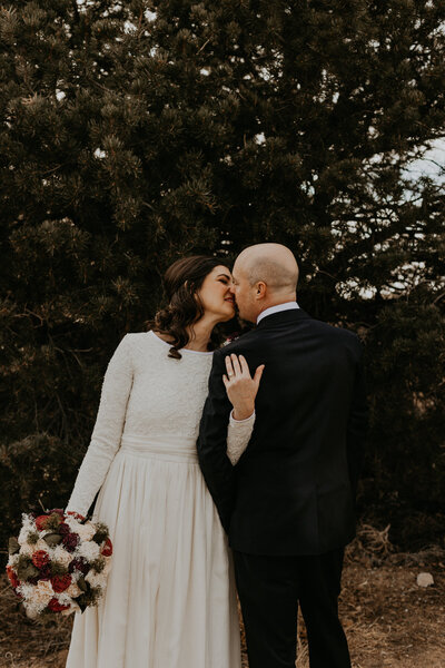 two brides holding each other and laughing