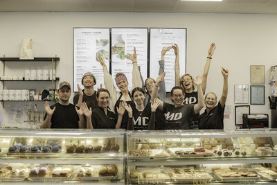 Employees at the bakery counter at Mason Dixon