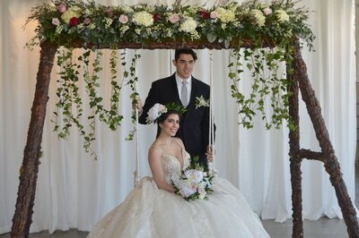 A swing is the perfect setting for a rustic wedding - Just Bloom'd Weddings is a bespoke wedding florist in Sudbury, MA servicing couples in New England for 35+ years.