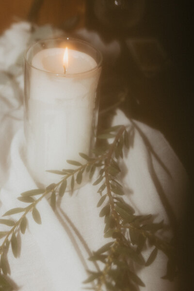 candle and greenery