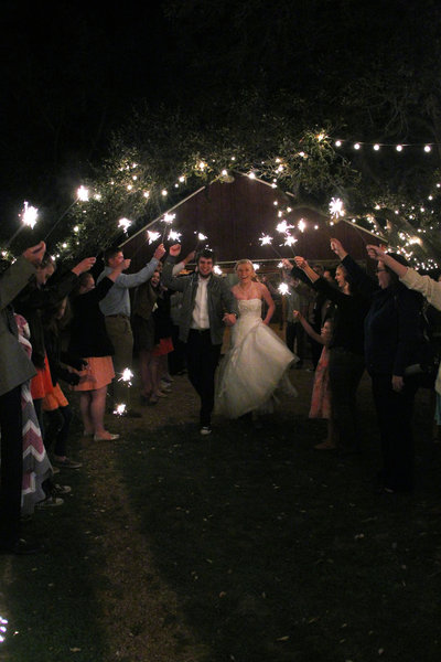 san antonio bride and groom walking through sparklers