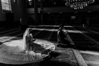 Bride and groom pray in mosque before their wedding