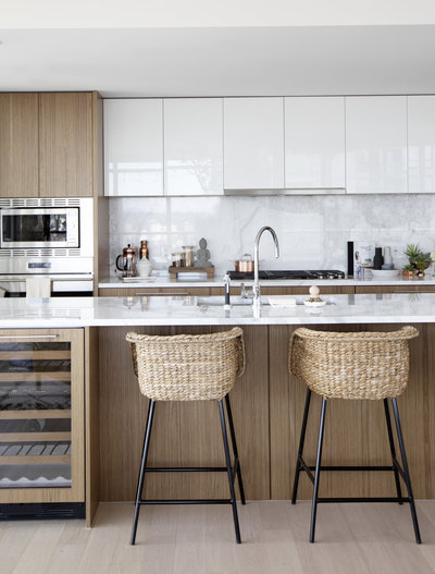 Woven Bucket Style Counter Stools in Modern Kitchen with Upper White and Lower Wood  Cabinetry, Marble Backsplash, Wine Fridge on Island