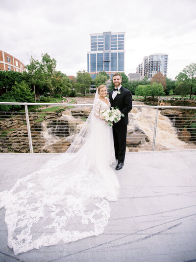 Bride and groom walk up memorial steps at their DC wedding