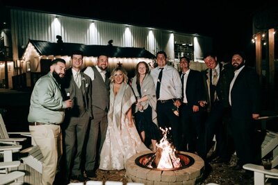 Fire pit with wedding guests surrounding